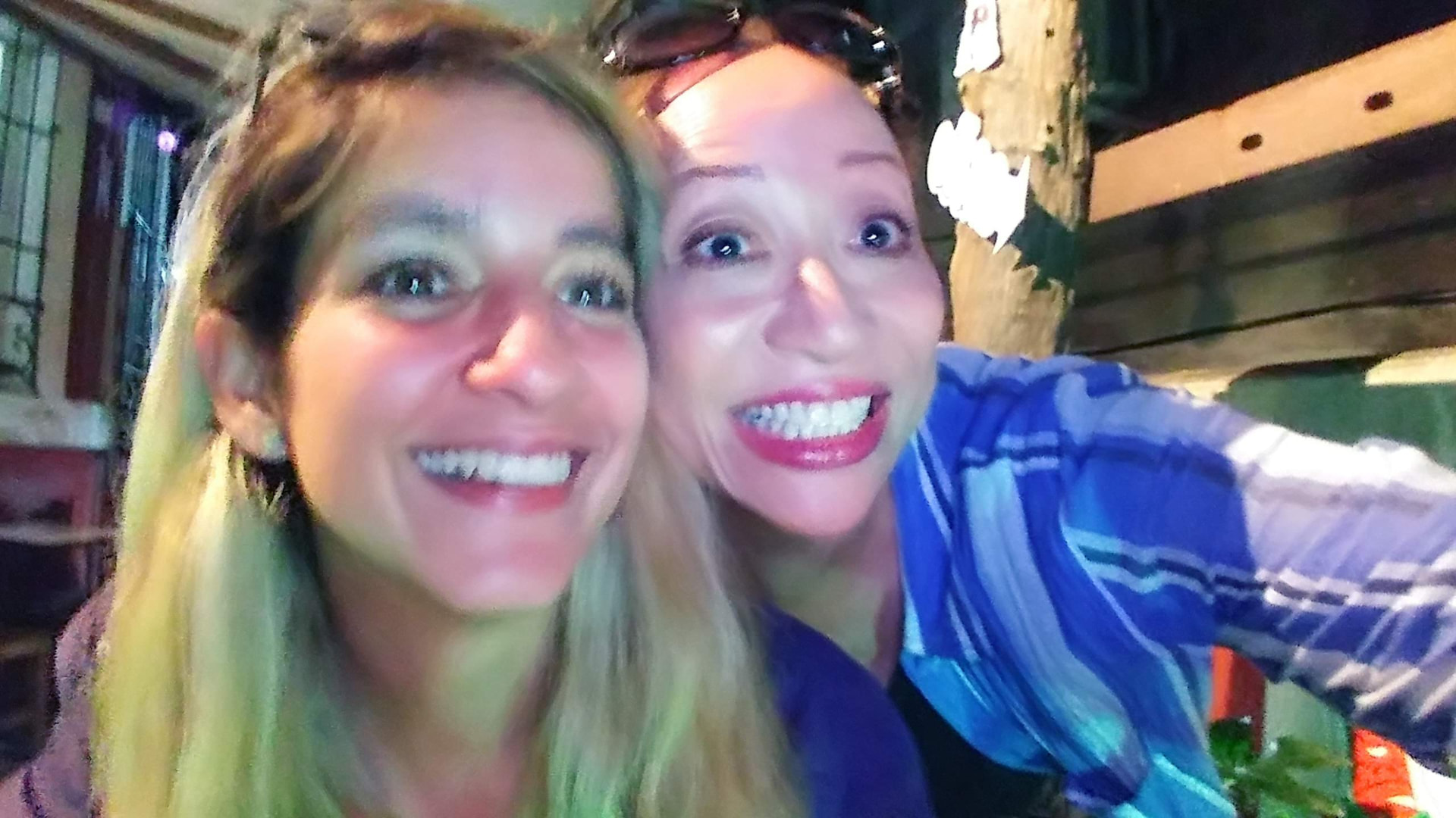 Allison and a companion smiling together during a night out in Havana