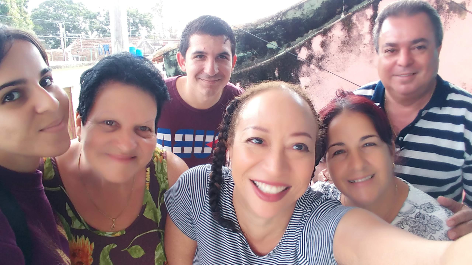 Allison and five companions gathered for a rooftop photograph in Havana